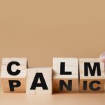 dental anxiety, wood blocks switching from the word "panic" to "calm"