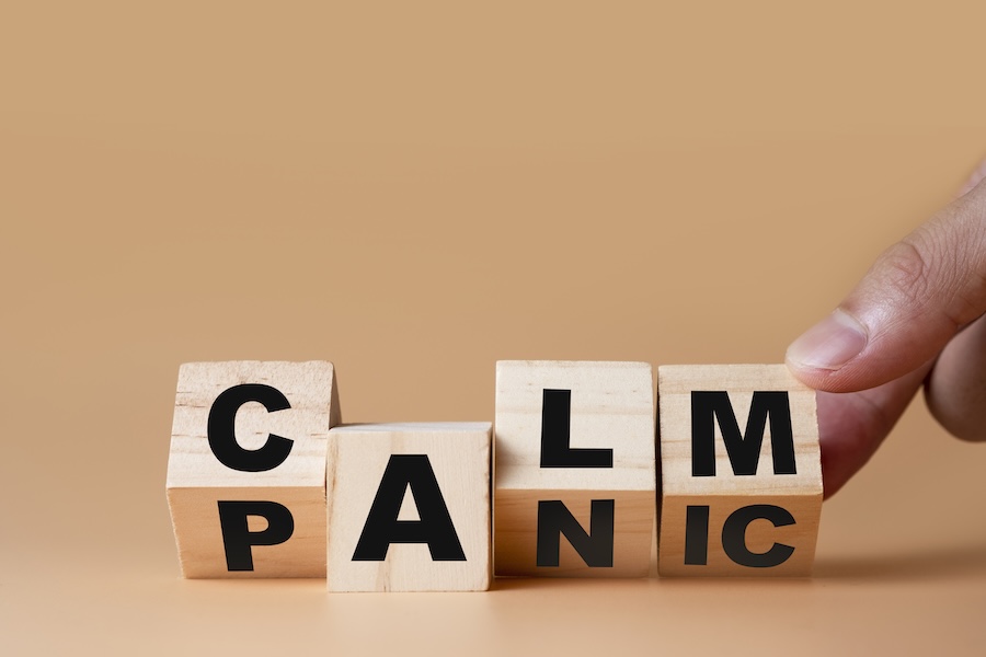dental anxiety, wood blocks switching from the word "panic" to "calm"
